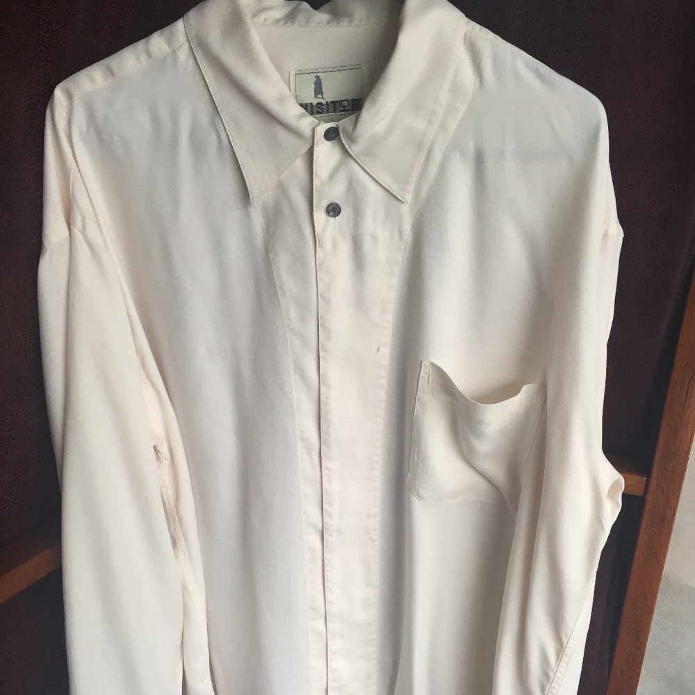 Large cream silk shirt.